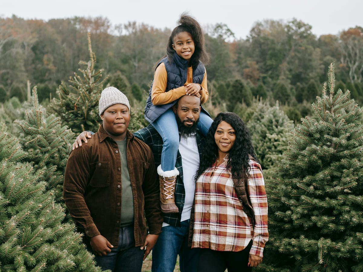Stack of coins next to a small piggy bank and a handwritten ledger